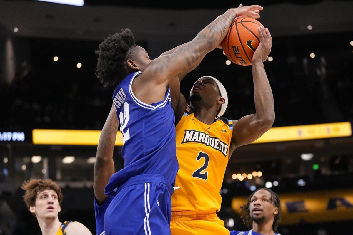 Dec 30, 2025; Milwaukee, Wisconsin, USA;  Seton Hall Pirates guard Elijah Fisher (22) defends Marquette Golden Eagles guard Chase Ross (2) during the second half at Fiserv Forum. Mandatory Credit: Jeff Hanisch-Imagn Images