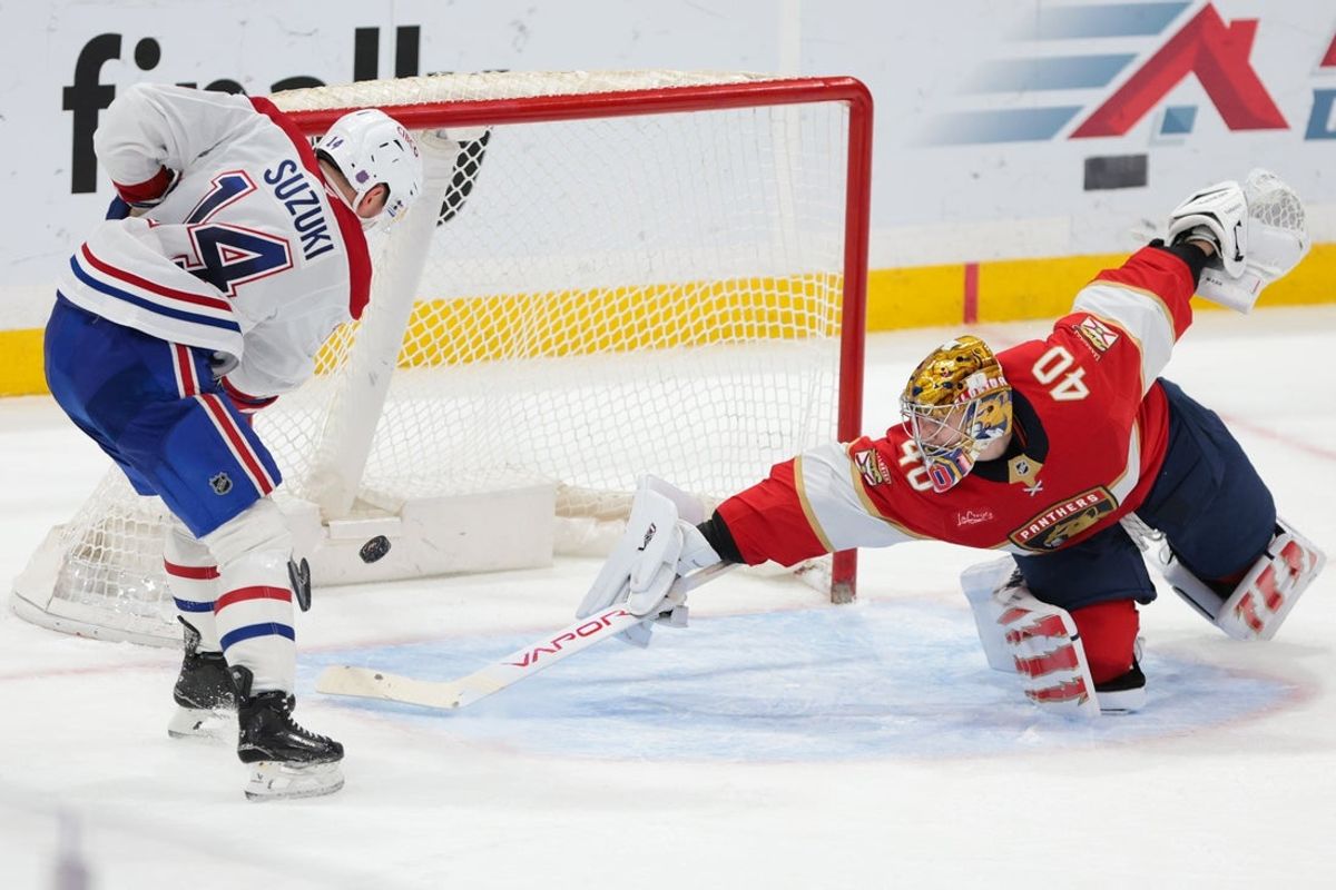 Dec 30, 2025; Sunrise, Florida, USA; Montreal Canadiens center Nick Suzuki (14) scores against Florida Panthers goaltender Daniil Tarasov (40) during overtime at Amerant Bank Arena. Mandatory Credit: Sam Navarro-Imagn Images