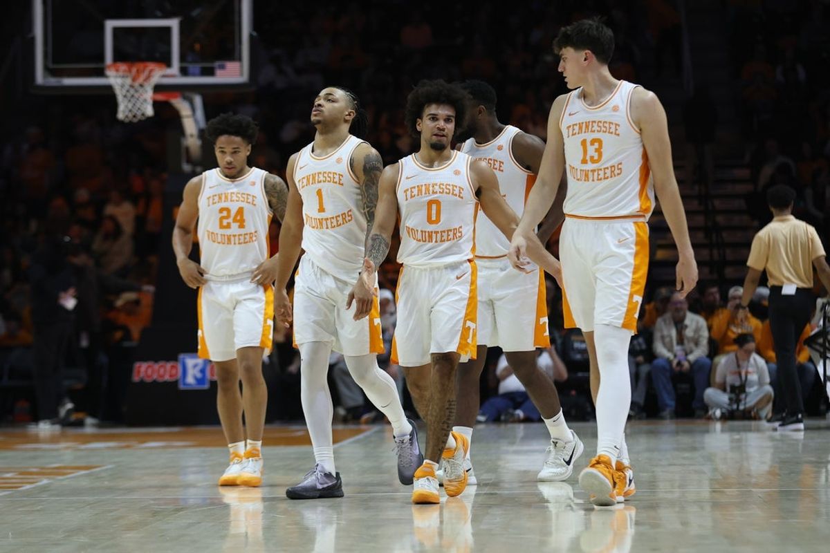 Dec 30, 2025; Knoxville, Tennessee, USA;  Tennessee Volunteers guard Troy Henderson (24), guard Amari Evans (1), guard Ja'Kobi Gillespie (0) and forward J.P. Estrella (13) after a timeout against the South Carolina State Bulldogs during the second half at Thompson-Boling Arena at Food City Center. Mandatory Credit: Randy Sartin-Imagn Images