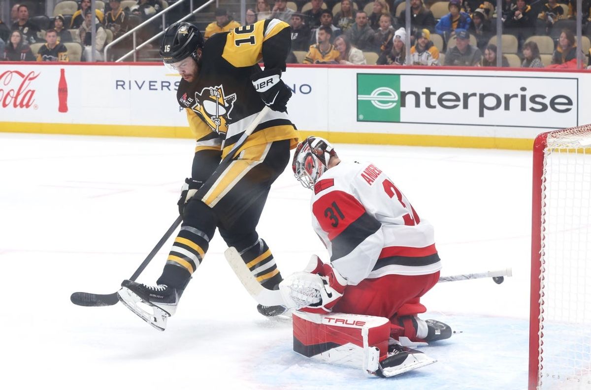 Dec 30, 2025; Pittsburgh, Pennsylvania, USA; Carolina Hurricanes goaltender Frederik Andersen (31) makes a save against Pittsburgh Penguins right wing Justin Brazeau (16) during the first period at PPG Paints Arena. Mandatory Credit: Charles LeClaire-Imagn Images