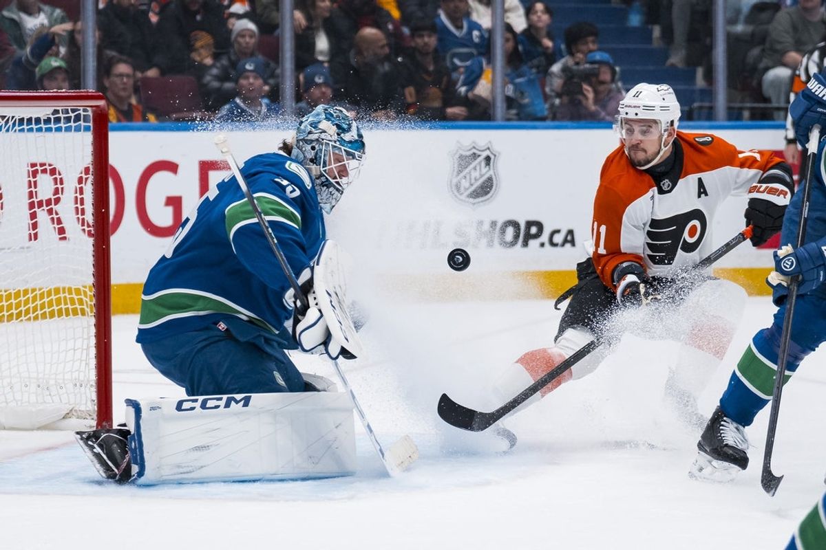 Dec 30, 2025; Vancouver, British Columbia, CAN; Philadelphia Flyers forward Travis Konecny (11) watches Vancouver Canucks goalie Thatcher Demko (35) make a save in the first period at Rogers Arena. Mandatory Credit: Bob Frid-Imagn Images