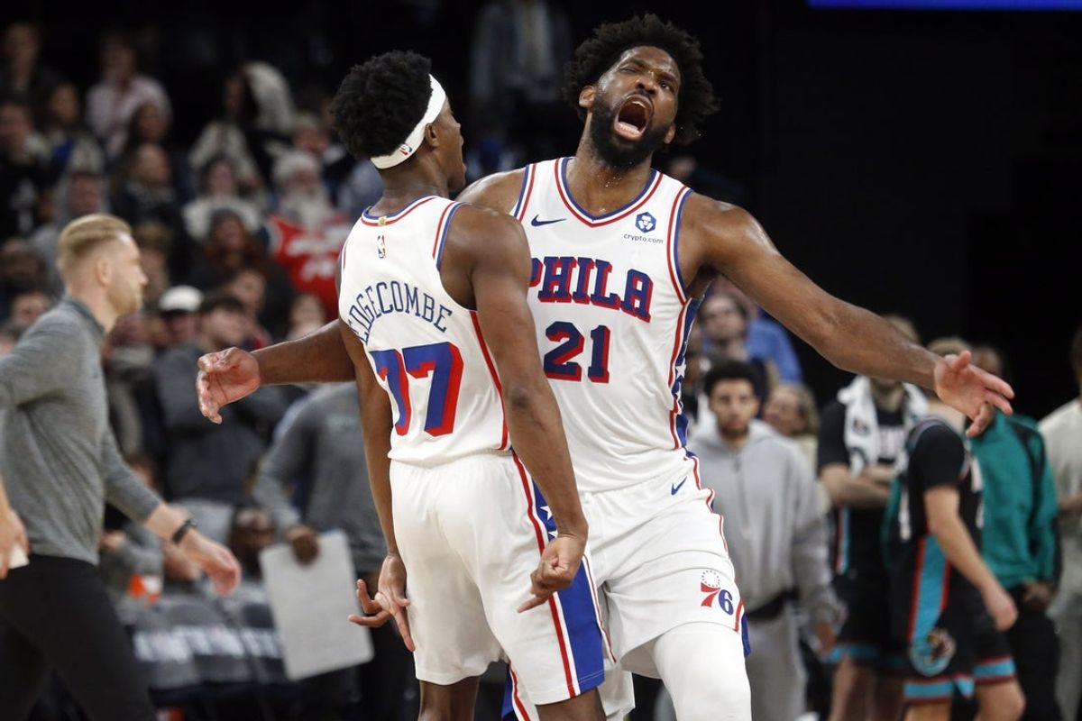 Dec 30, 2025; Memphis, Tennessee, USA; Philadelphia 76ers center Joel Embiid (21) reacts with guard VJ Edgecombe (77) after scoring a game winning three during overtime against the Memphis Grizzlies at FedExForum. Mandatory Credit: Petre Thomas-Imagn Images