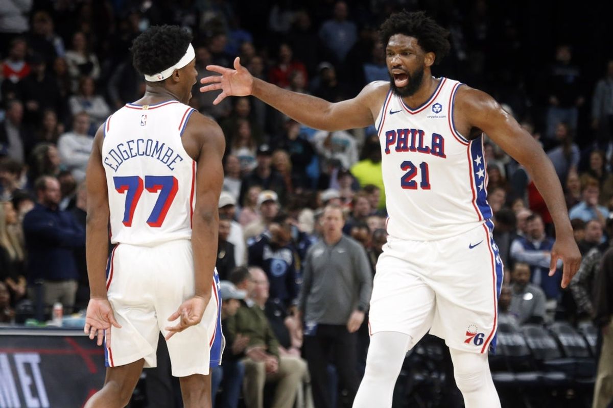 Dec 30, 2025; Memphis, Tennessee, USA; Philadelphia 76ers center Joel Embiid (21) reacts with guard VJ Edgecombe (77) after scoring a game winning three during overtime against the Memphis Grizzlies at FedExForum. Mandatory Credit: Petre Thomas-Imagn Images