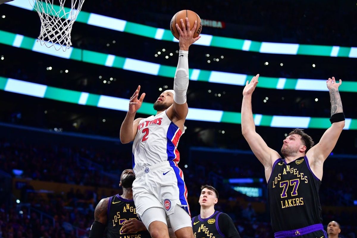 Dec 30, 2025; Los Angeles, California, USA; Detroit Pistons guard Cade Cunningham (2) shoots ahead of Los Angeles Lakers guard Luka Doncic (77) during the first half at Crypto.com Arena. Mandatory Credit: Gary A. Vasquez-Imagn Images