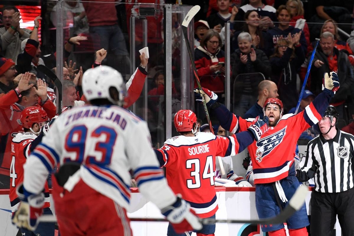 Dec 31, 2025; Washington, District of Columbia, USA; Washington Capitals right wing Tom Wilson (43) celebrates with right wing Justin Sourdif (34) after scoring a goal against the New York Rangers during the third period at Capital One Arena. Mandatory Credit: Hannah Foslien-Imagn Images