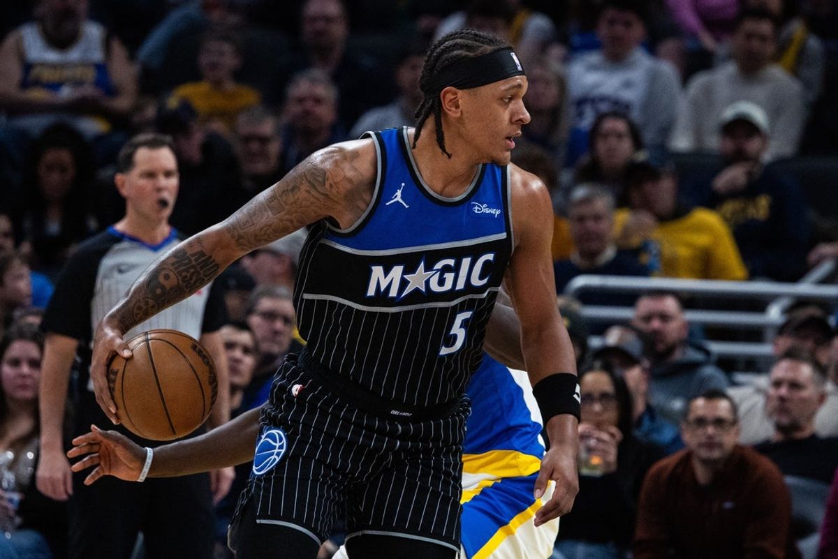 Dec 31, 2025; Indianapolis, Indiana, USA;  Orlando Magic forward Paolo Banchero (5) dribbles the ball while Indiana Pacers forward Pascal Siakam (43) defends in the first half at Gainbridge Fieldhouse. Mandatory Credit: Trevor Ruszkowski-Imagn Images