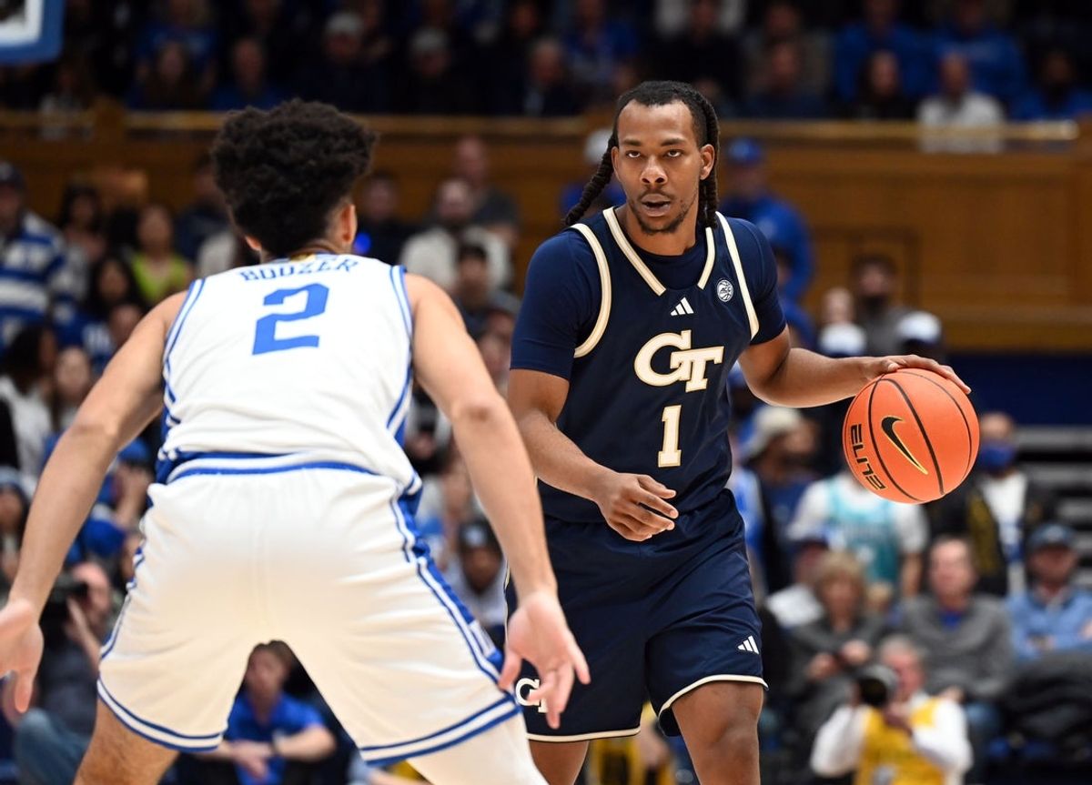 Dec 31, 2025; Durham, North Carolina, USA; Georgia Tech Yellow Jackets guard Lamar Washington (1) controls the ball in front of Duke Blue Devils guard Cayden Boozer (2)during the first half at Cameron Indoor Stadium. Mandatory Credit: Rob Kinnan-Imagn Images