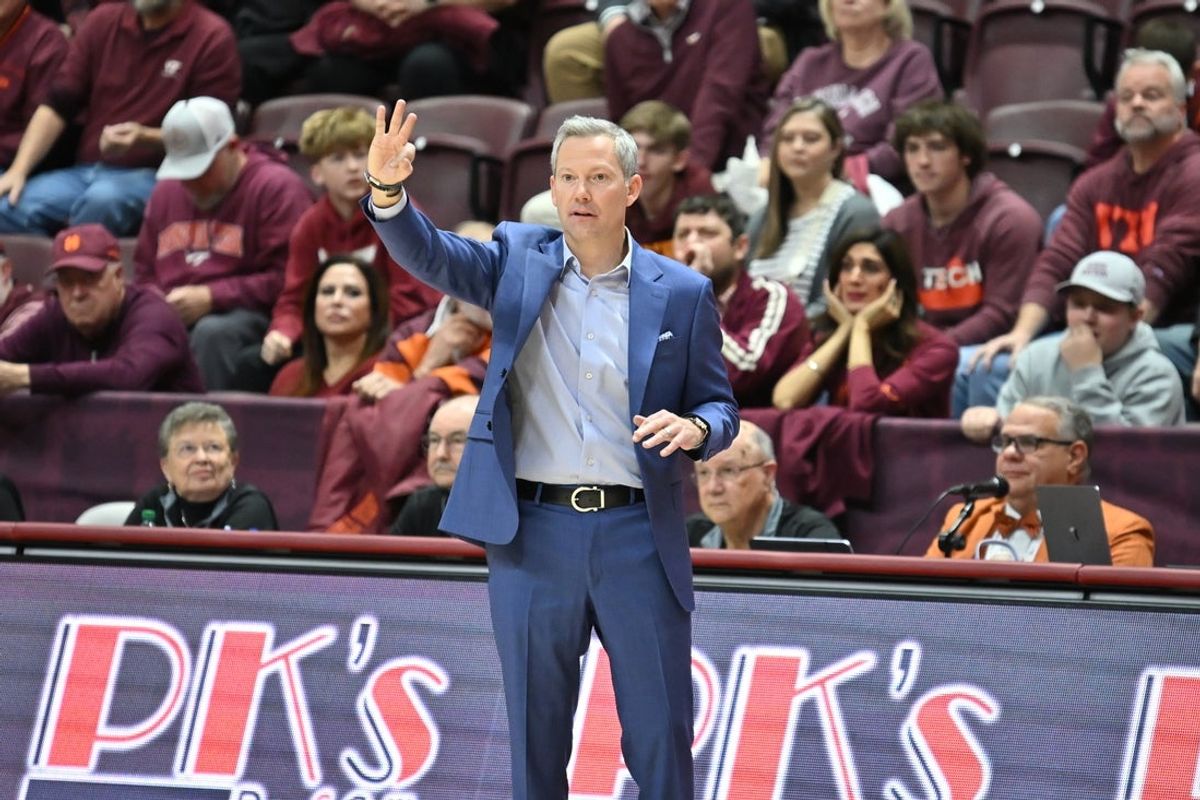 Dec 31, 2025; Blacksburg, Virginia, USA; Virginia Cavaliers head coach Ryan Odom gives his team instructions during the third overtime at Cassell Coliseum. Mandatory Credit: Brian Bishop-Imagn Images