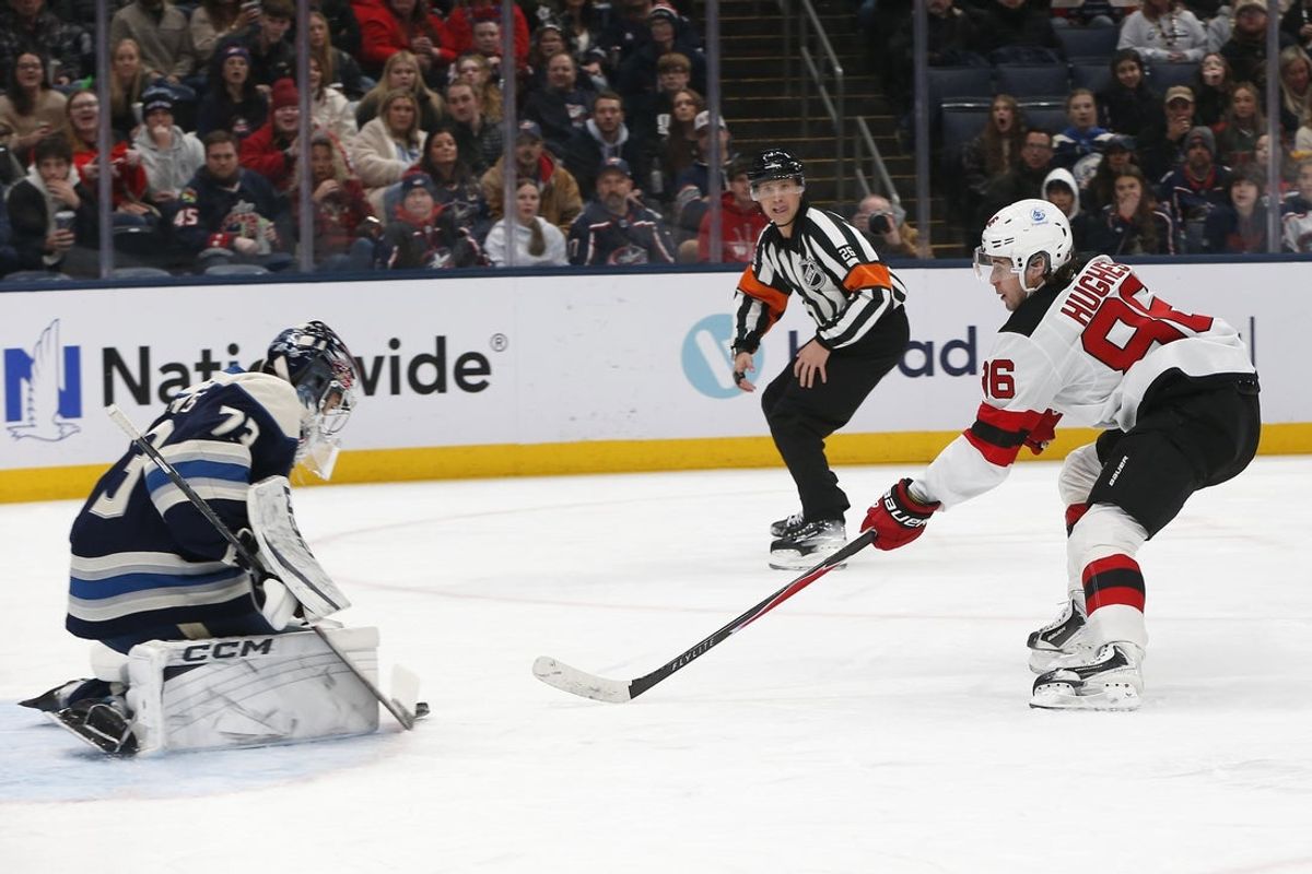 Dec 31, 2025; Columbus, Ohio, USA; Columbus Blue Jackets goalie Jet Greaves (73) makes a save on the breakaway shot from New Jersey Devils center Jack Hughes (86) during the first period at Nationwide Arena. Mandatory Credit: Russell LaBounty-Imagn Images