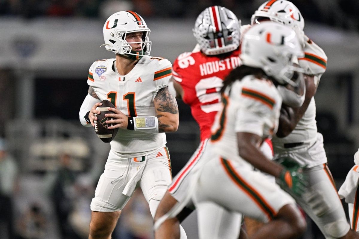 Dec 31, 2025; Arlington, TX, USA; Miami Hurricanes quarterback Carson Beck (11) looks to throw in the second quarter against the Ohio State Buckeyes during the 2025 Cotton Bowl and quarterfinal game of the College Football Playoff at AT&T Stadium. Mandatory Credit: Jerome Miron-Imagn Images