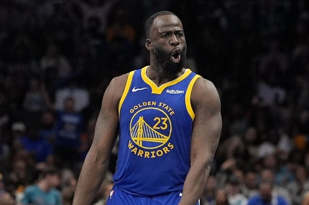 Dec 31, 2025; Charlotte, North Carolina, USA; Golden State Warriors forward Draymond Green (23) reacts to his three point basket during the second half against the Charlotte Hornets at Spectrum Center. Mandatory Credit: Jim Dedmon-Imagn Images