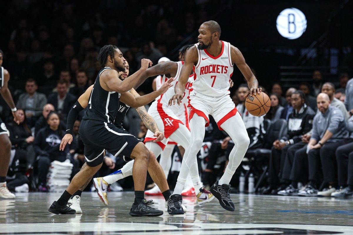 Jan 1, 2026; Brooklyn, New York, USA; Houston Rockets forward Kevin Durant (7) is guarded by Brooklyn Nets guard Cam Thomas (24) during the first half at Barclays Center. Mandatory Credit: Vincent Carchietta-Imagn Images