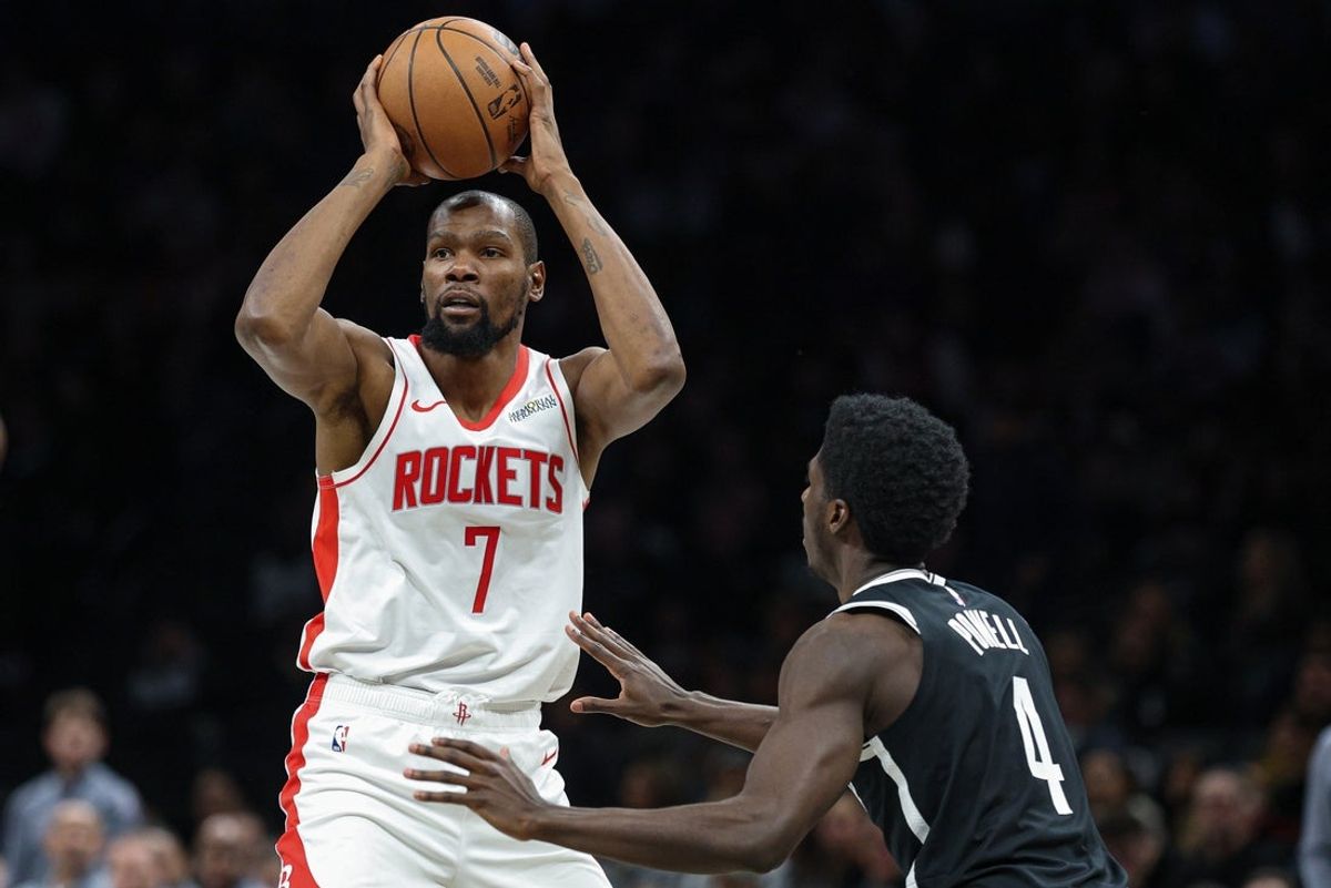 Jan 1, 2026; Brooklyn, New York, USA; Houston Rockets forward Kevin Durant (7) looks to pass as Brooklyn Nets guard Drake Powell (4) defends during the second half at Barclays Center. Mandatory Credit: Vincent Carchietta-Imagn Images