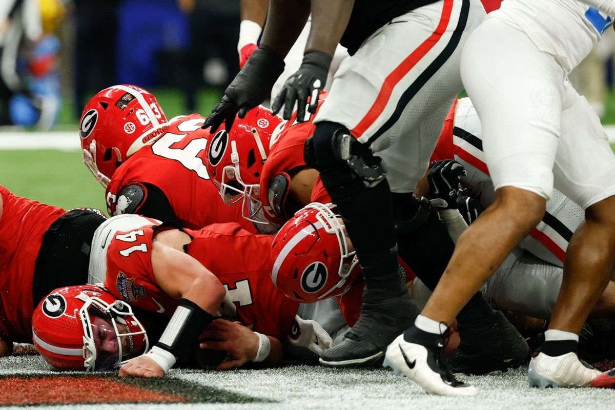 Jan 1, 2026; New Orleans, LA, USA; Georgia Bulldogs quarterback Gunner Stockton (14) scores a touchdown against the Mississippi Rebels in the second quarter during the 2025 Sugar Bowl and quarterfinal game of the College Football Playoff at Caesars Superdome. Mandatory Credit: Geoff Burke-Imagn Images
