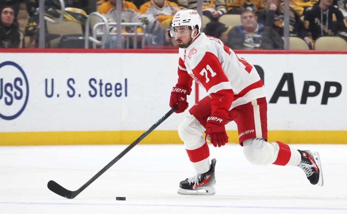 Jan 1, 2026; Pittsburgh, Pennsylvania, USA;  Detroit Red Wings center Dylan Larkin (71) skates with the puck against the Pittsburgh Penguins during the third period at PPG Paints Arena. Mandatory Credit: Charles LeClaire-Imagn Images