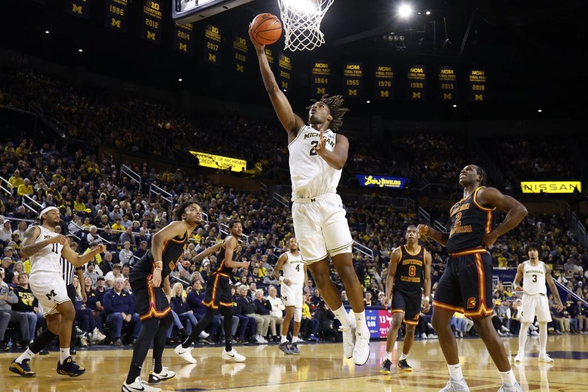 Jan 2, 2026; Ann Arbor, Michigan, USA;  Michigan Wolverines forward Morez Johnson Jr. (21) shoots in the first half against the Southern California Trojans at Crisler Center. Mandatory Credit: Rick Osentoski-Imagn Images