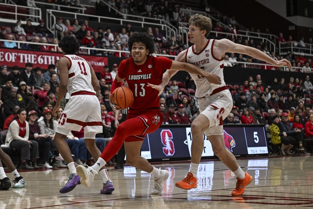 Jan 2, 2025; Stanford, California, USA; Louisville Cardinals forward Sananda Fru (13) dribbles against Stanford Cardinal forward Oskar Giltay (15) during the first half at Maples Pavilion. Mandatory Credit: Justine Willard-Imagn Images