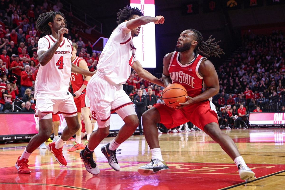 Jan 2, 2026; Piscataway, New Jersey, USA; Ohio State Buckeyes guard Bruce Thornton (2) goes to the basket as Rutgers Scarlet Knights guard Tariq Francis (0) and forward Bryce Dortch (4) defends during the first half at Jersey Mike's Arena. Mandatory Credit: Vincent Carchietta-Imagn Images