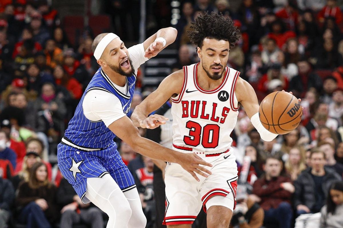 Jan 2, 2026; Chicago, Illinois, USA; Orlando Magic guard Jalen Suggs (4) defends against Chicago Bulls guard Tre Jones (30) during the first half at United Center. Mandatory Credit: Kamil Krzaczynski-Imagn Images