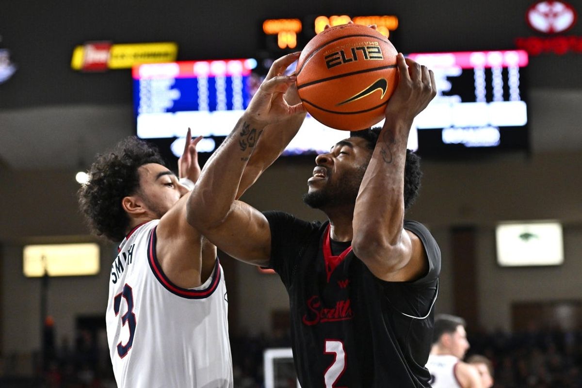 Jan 2, 2026; Spokane, Washington, USA; Seattle U Redhawks guard Miles Amos (2) is fouled on the shot by Gonzaga Bulldogs guard Braeden Smith (3) in the first half at McCarthey Athletic Center. Mandatory Credit: James Snook-Imagn Images
