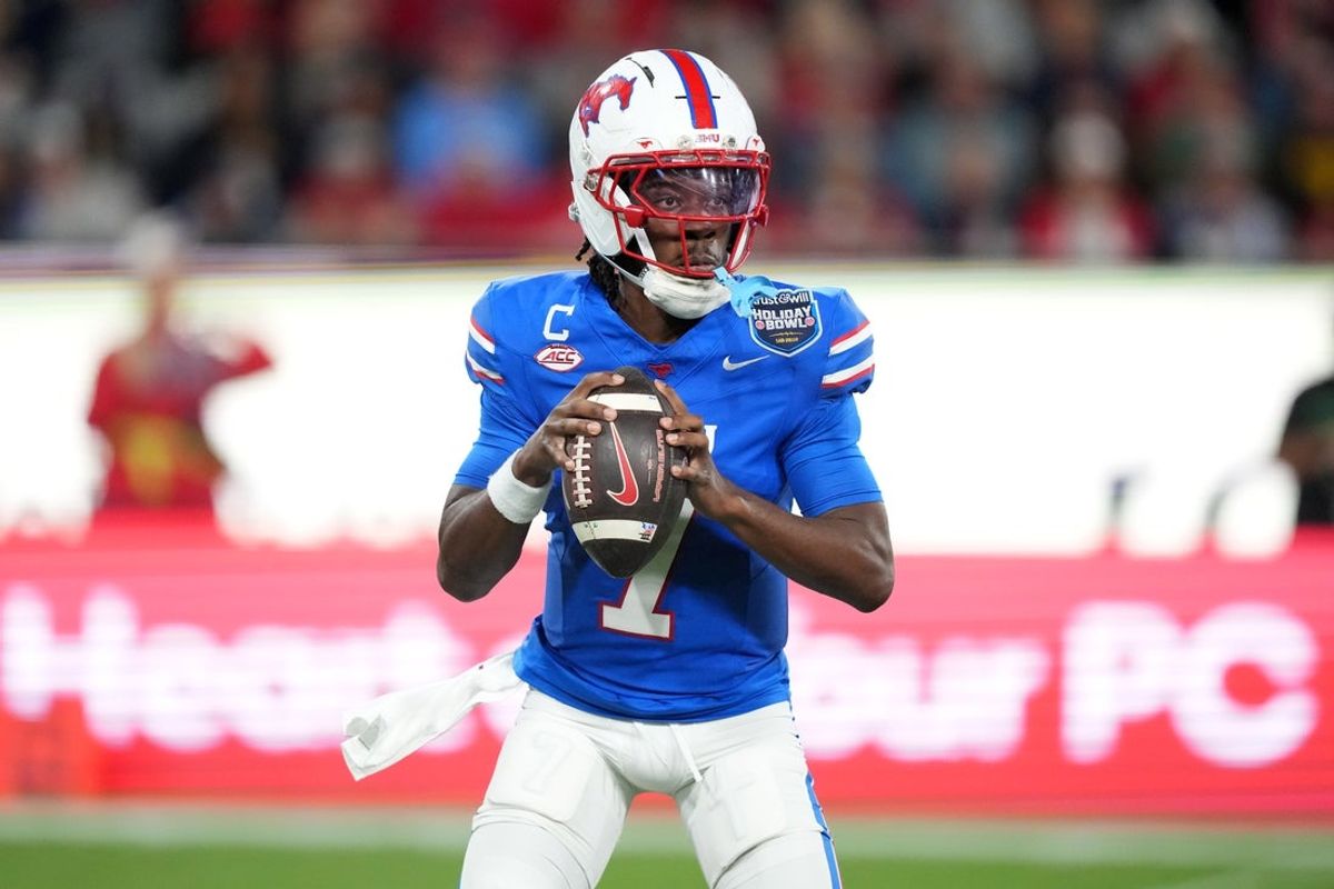 Jan 2, 2026; San Diego, CA, USA; SMU Mustangs quarterback Kevin Jennings (7) throws the ball against the Arizona Wildcats in the first half during the Holiday Bowl at Snapdragon Stadium. Mandatory Credit: Kirby Lee-Imagn Images