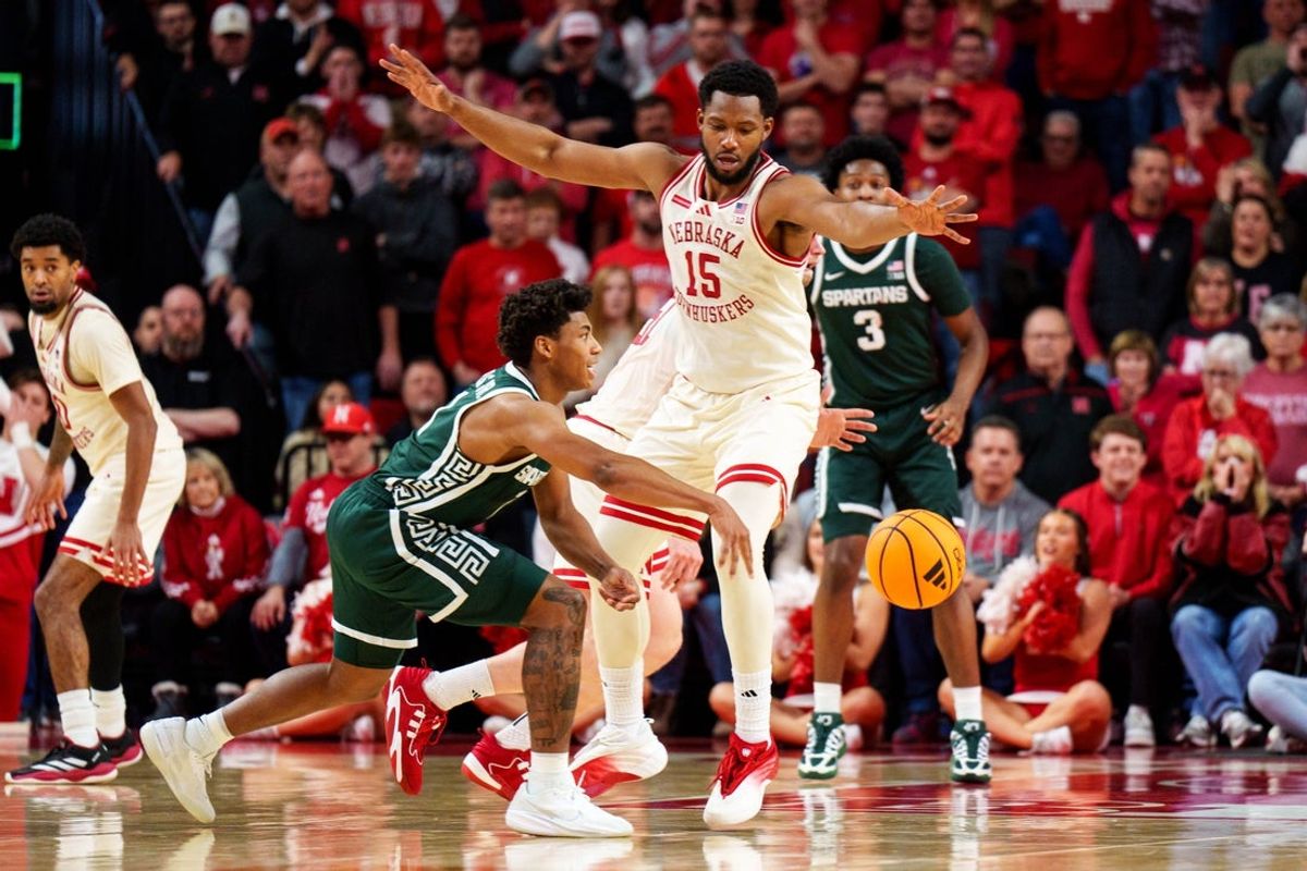 Jan 2, 2026; Lincoln, Nebraska, USA; Michigan State Spartans guard Jeremy Fears Jr. (1) passes against Nebraska Cornhuskers forward Jared Garcia (15) during the first half at Pinnacle Bank Arena. Mandatory Credit: Dylan Widger-Imagn Images