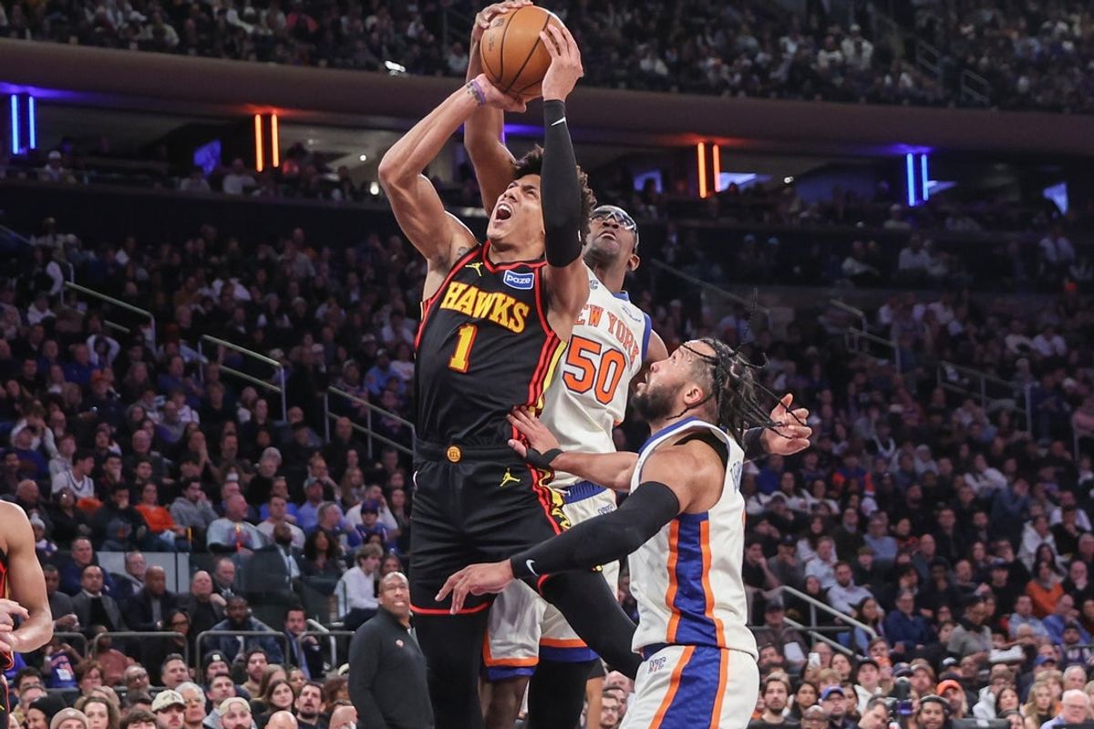 Jan 2, 2026; New York, New York, USA;  Atlanta Hawks forward Jalen Johnson (1) looks to drive past New York Knicks forward Trey Jemison III (50) and guard Jalen Brunson (11) in the third quarter at Madison Square Garden. Mandatory Credit: Wendell Cruz-Imagn Images