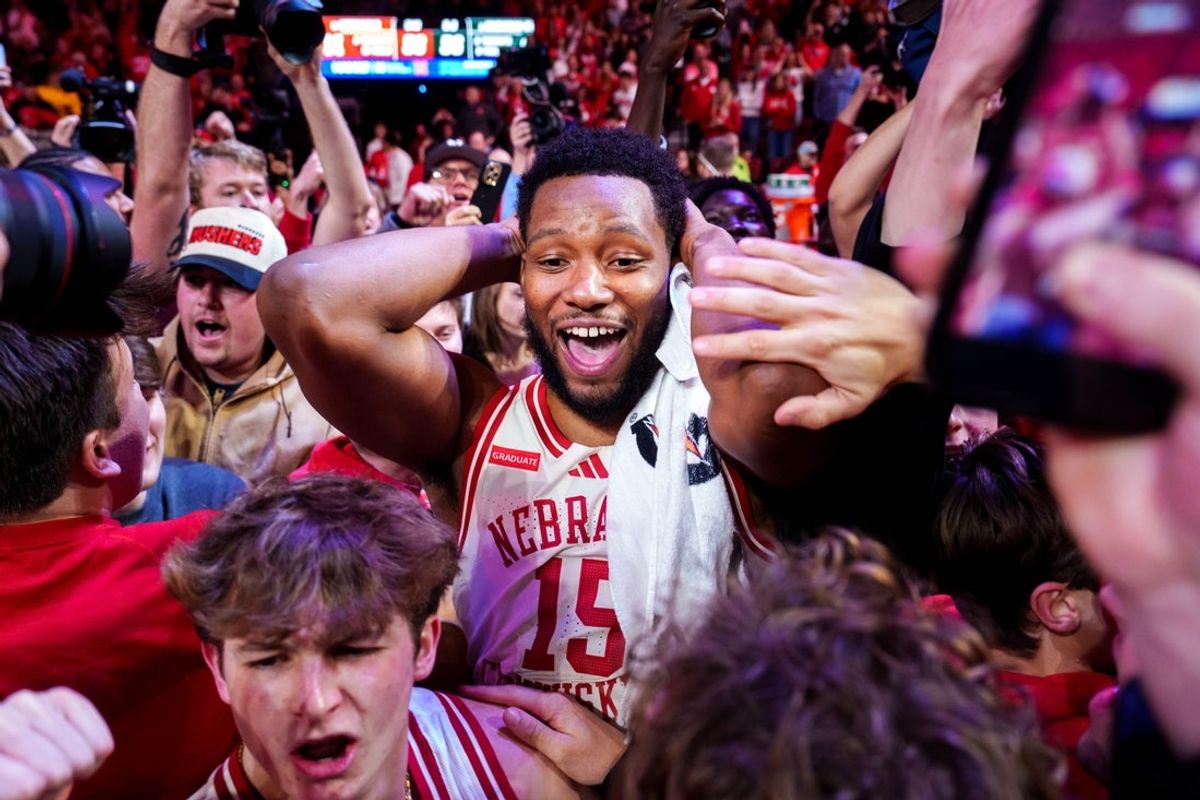 Jan 2, 2026; Lincoln, Nebraska, USA; Nebraska Cornhuskers forward Jared Garcia (15) celebrates with fans after defeating the Michigan State Spartans at Pinnacle Bank Arena. Mandatory Credit: Dylan Widger-Imagn Images