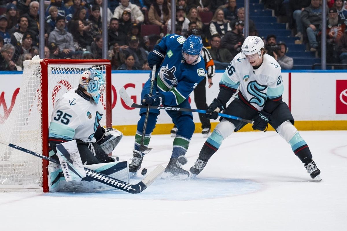 Jan 2, 2026; Vancouver, British Columbia, CAN; Seattle Kraken goalie Joey Daccord (35) and forward Ryan Winterton (26) watch as Vancouver Canucks forward Filip Chytil (72) scores on Daccord in the second period at Rogers Arena. Mandatory Credit: Bob Frid-Imagn Images
