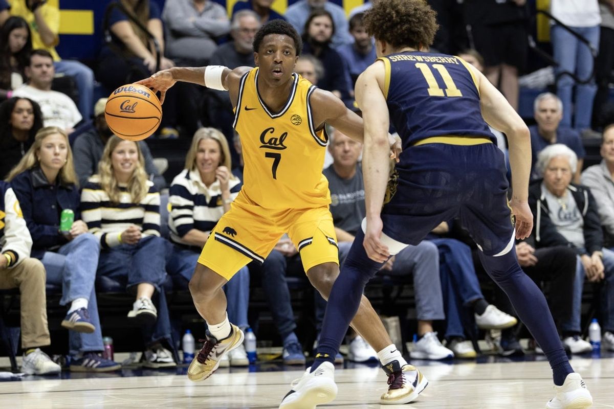 Jan 2, 2026; Berkeley, California, USA; California Golden Bears guard Dai Dai Ames (7) looks to drive around Notre Dame Fighting Irish guard Braeden Shrewsberry (11) during the second half at Haas Pavilion. Mandatory Credit: D. Ross Cameron-Imagn Images