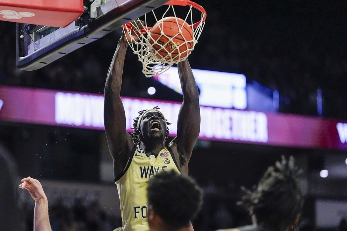 Jan 3, 2026; Winston-Salem, North Carolina, USA;Wake Forest Demon Deacons forward Omaha Biliew (0) with a slam dunk against the Virginia Tech Hokies during the first half at Lawrence Joel Veterans Memorial Coliseum. Mandatory Credit: Jim Dedmon-Imagn Images