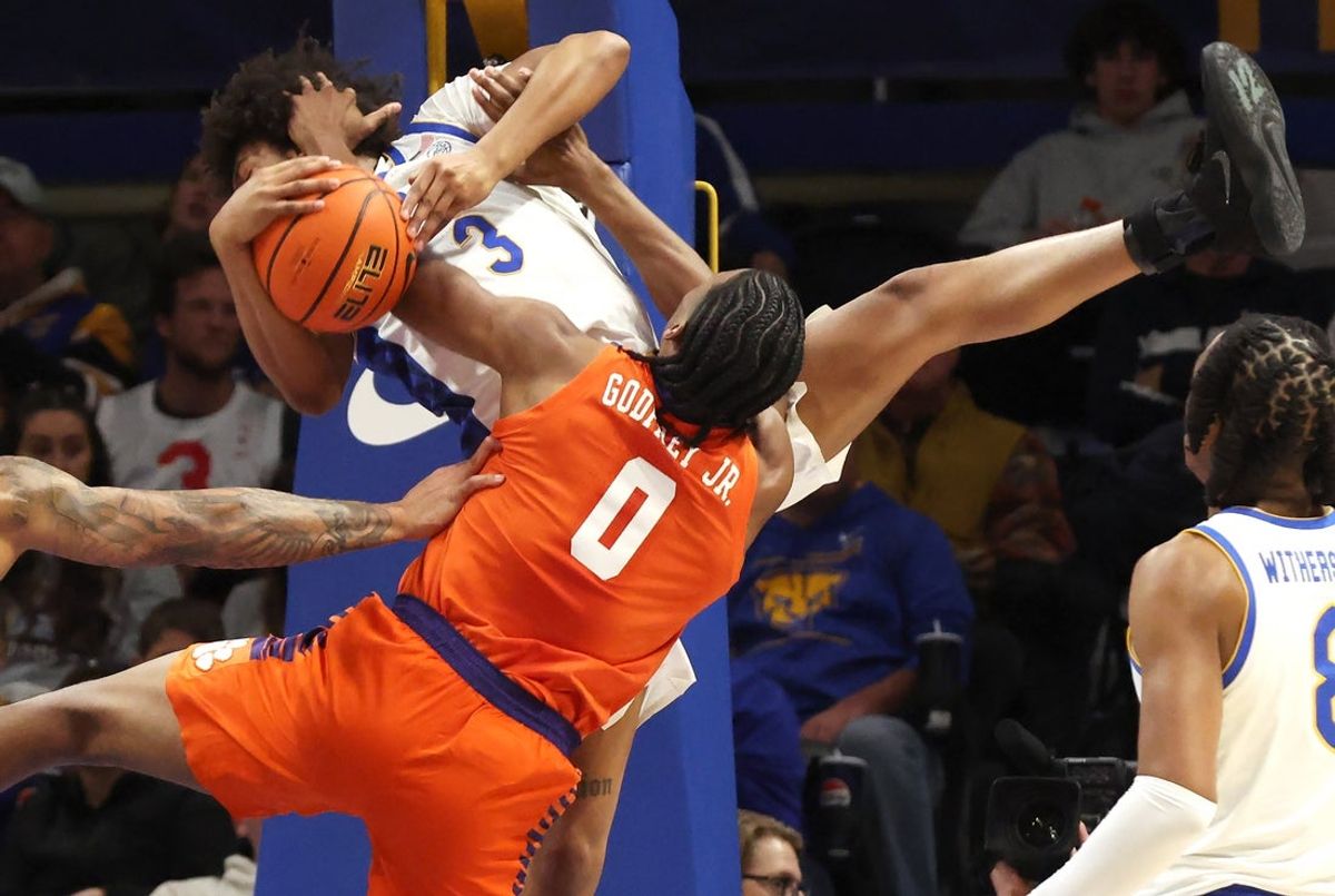 Jan 3, 2026; Pittsburgh, Pennsylvania, USA;  Pittsburgh Panthers guard Brandin Cummings (3) fouls Clemson Tigers forward RJ Godfrey (0) during the first half at the Petersen Events Center. Mandatory Credit: Charles LeClaire-Imagn Images