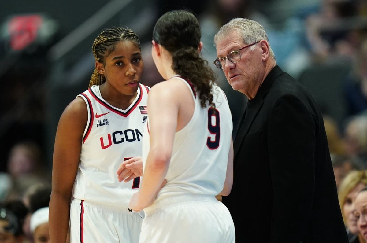Jan 3, 2026; Hartford, Connecticut, USA; UConn Huskies head coach Geno Auriemma talks with guard Kayleigh Heckel (9) and guard Kelis Fisher (7) from the sideline as they take on the Seton Hall Pirates at PeoplesBank Arena. Mandatory Credit: David Butler II-Imagn Images