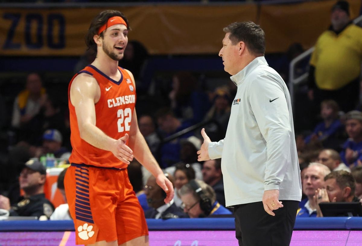 Jan 3, 2026; Pittsburgh, Pennsylvania, USA;  Clemson Tigers center Carter Welling (22) reacts with Tigers head coach Brad Brownell against the Pittsburgh Panthers during the second half at the Petersen Events Center. Mandatory Credit: Charles LeClaire-Imagn Images
