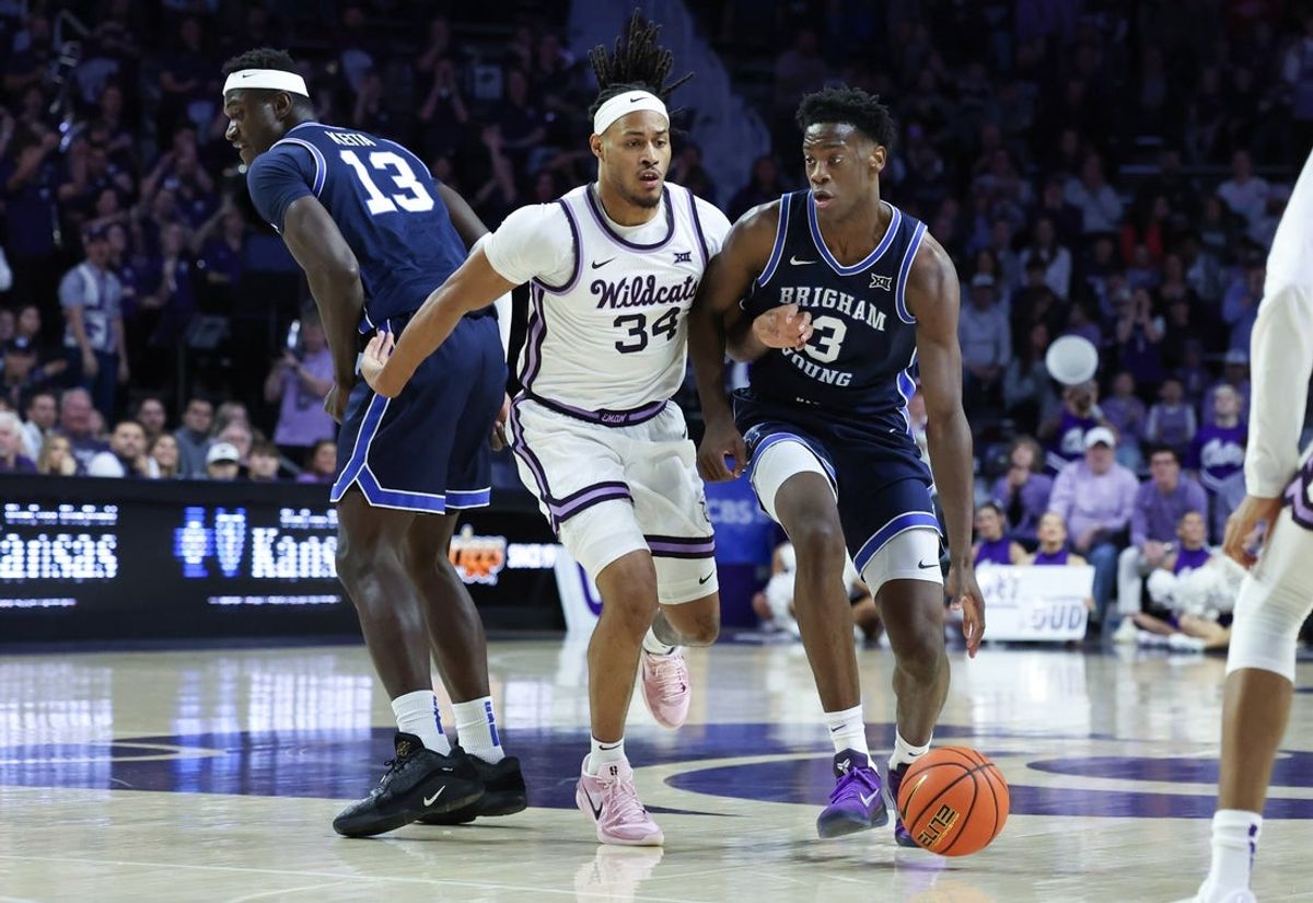 Jan 3, 2026; Manhattan, Kansas, USA; Brigham Young Cougars forward AJ Dybantsa (3) dribbles against Kansas State Wildcats guard Nate Johnson (34)] during the first half at Bramlage Coliseum. Mandatory Credit: Scott Sewell-Imagn Images
