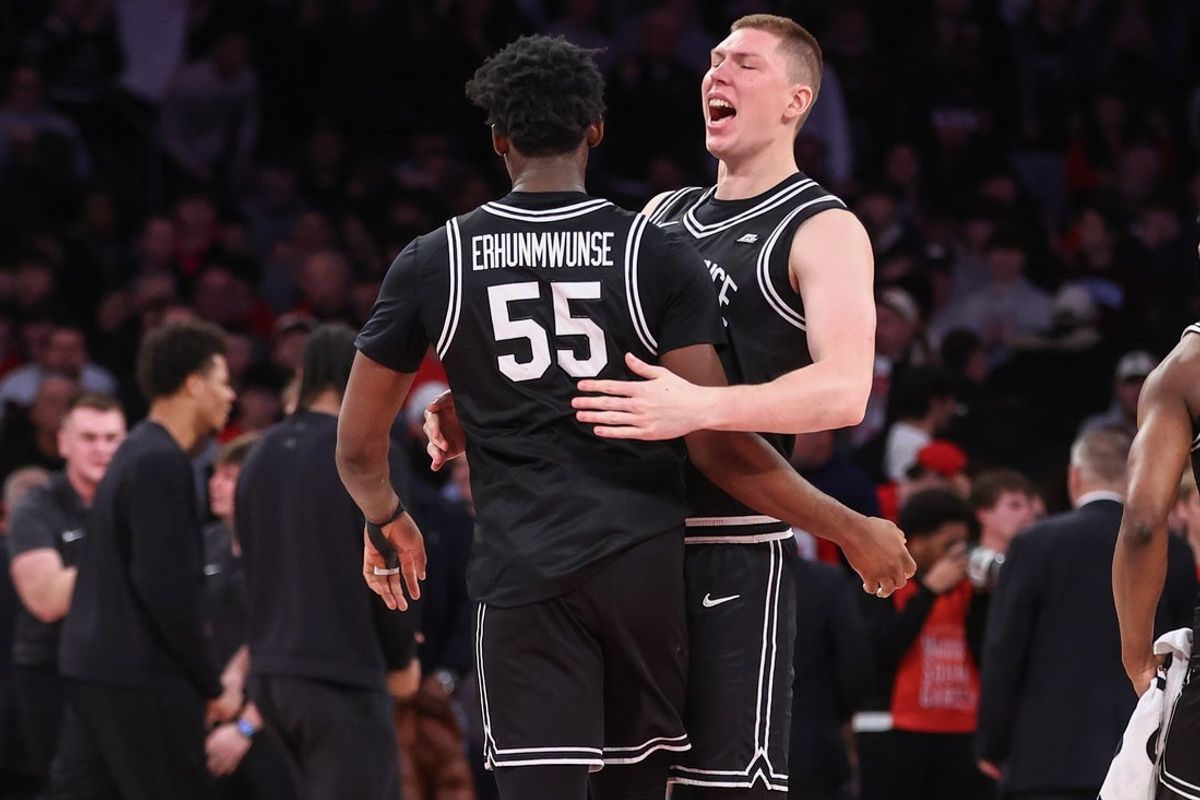 Jan 3, 2026; New York, New York, USA;  Providence Friars forwards Oswin Erhunmwunse (55) and Peteris Pinnis (17) celebrate after defeating the St. John's Red Storm 77-71 at Madison Square Garden. Mandatory Credit: Wendell Cruz-Imagn Images