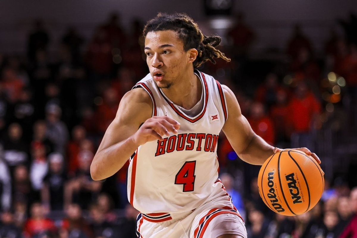 Jan 3, 2026; Cincinnati, Ohio, USA; Houston Cougars guard Kingston Flemings (4) dribbles against the Cincinnati Bearcats in the first half at Fifth Third Arena. Mandatory Credit: Katie Stratman-Imagn Images