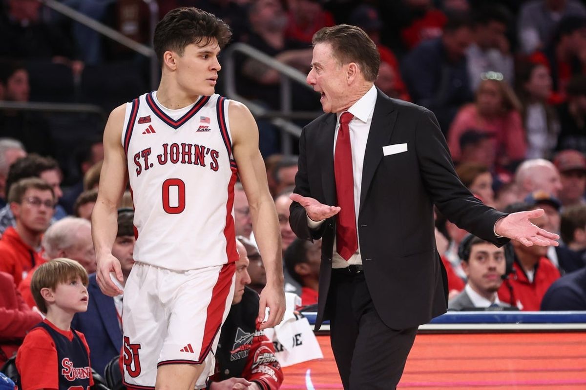 Jan 3, 2026; New York, New York, USA;  St. John's Red Storm head coach Rick Pitino talks with guard Dylan Darling (0) in the second half against the Providence Friars at Madison Square Garden. Mandatory Credit: Wendell Cruz-Imagn Images