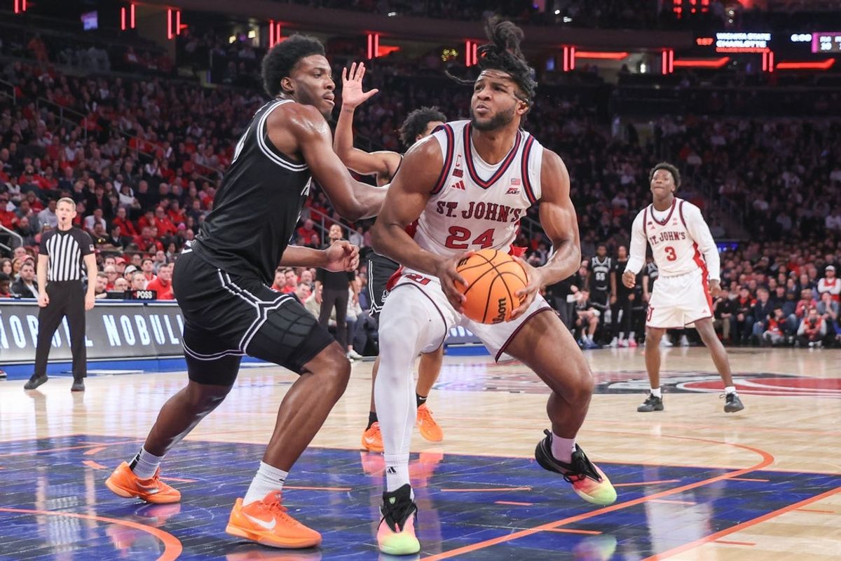 Jan 3, 2026; New York, New York, USA;  St. John's Red Storm forward Zuby Ejiofor (24) looks to post up against Providence Friars forward Cole Hargrove (13) in the second half at Madison Square Garden. Mandatory Credit: Wendell Cruz-Imagn Images