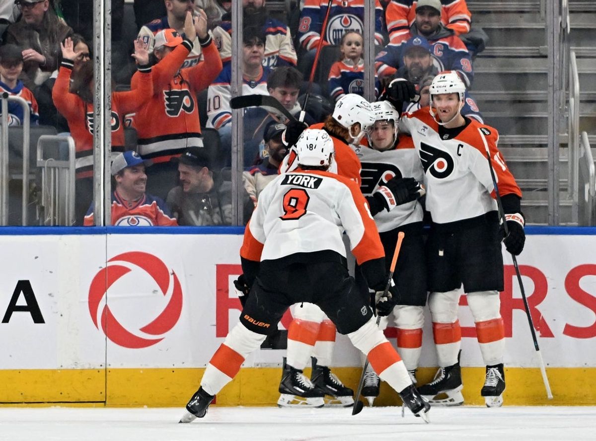 Jan 3, 2026; Edmonton, Alberta, CAN;   Philadelphia Flyers defenseman Jamie Drysdale (9) with Flyers center Denver Barkey (52) and Flyers center Sean Couturier (14) celebrates Barkey’s goal against the Edmonton Oilers during the first period at Rogers Place. Mandatory Credit: Walter Tychnowicz-Imagn Images