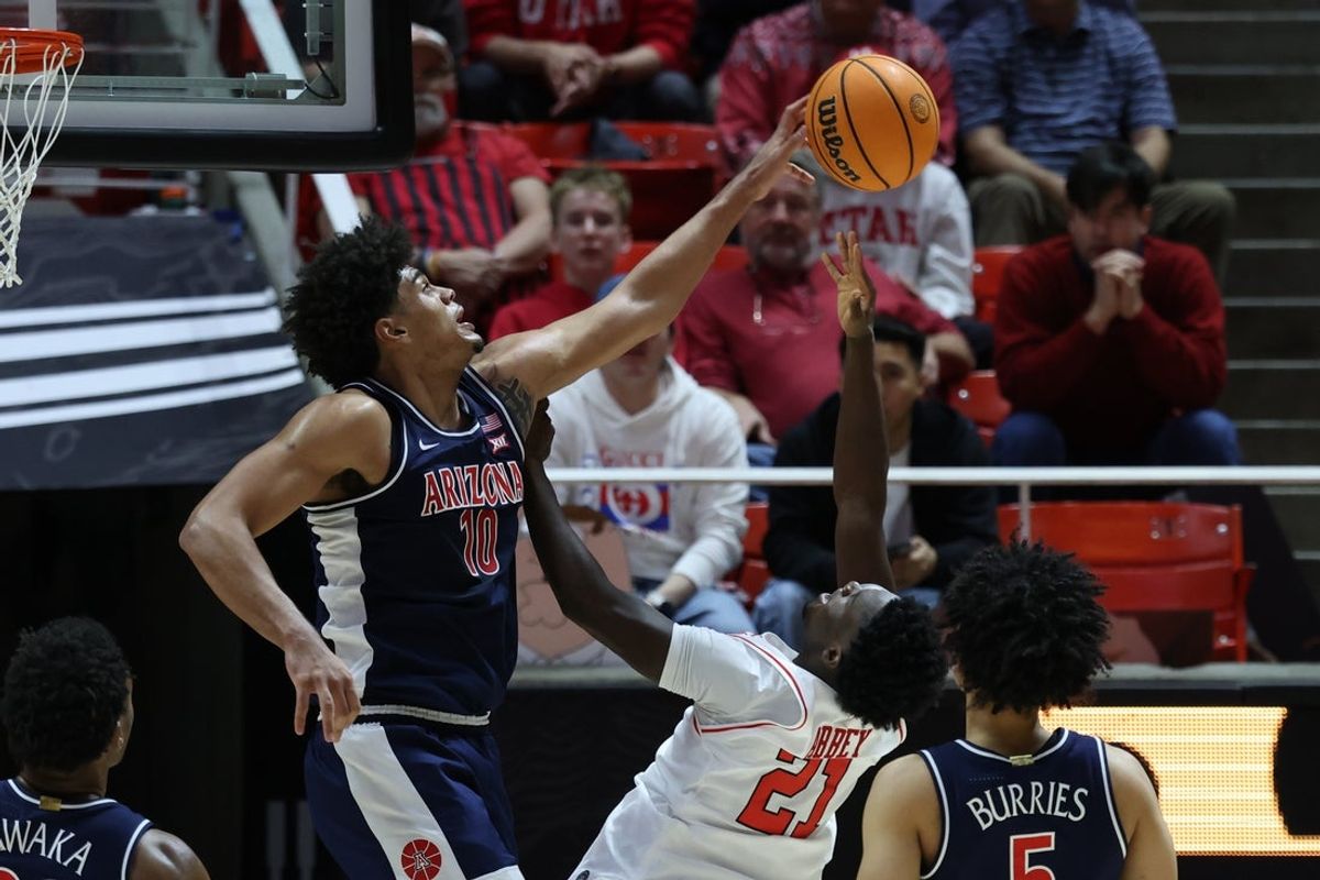 Jan 3, 2026; Salt Lake City, Utah, USA; Arizona Wildcats forward Koa Peat (10) blocks the shot of Utah Utes guard Obomate Abbey (21) during the first half at Jon M. Huntsman Center. Mandatory Credit: Rob Gray-Imagn Images