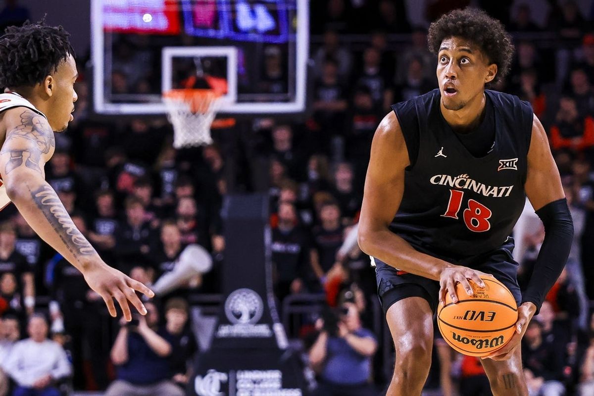 Jan 3, 2026; Cincinnati, Ohio, USA; Cincinnati Bearcats forward Baba Miller (18) holds the ball against the Houston Cougars in the second half at Fifth Third Arena. Mandatory Credit: Katie Stratman-Imagn Images