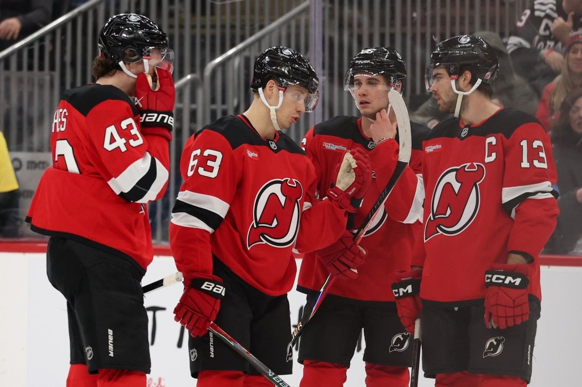 Jan 3, 2026; Newark, New Jersey, USA; New Jersey Devils defenseman Luke Hughes (43), left wing Jesper Bratt (63) center Jack Hughes (86) and center Nico Hischier (13) talk during the second period of their game against the Utah Mammoth at Prudential Center. Mandatory Credit: Ed Mulholland-Imagn Images