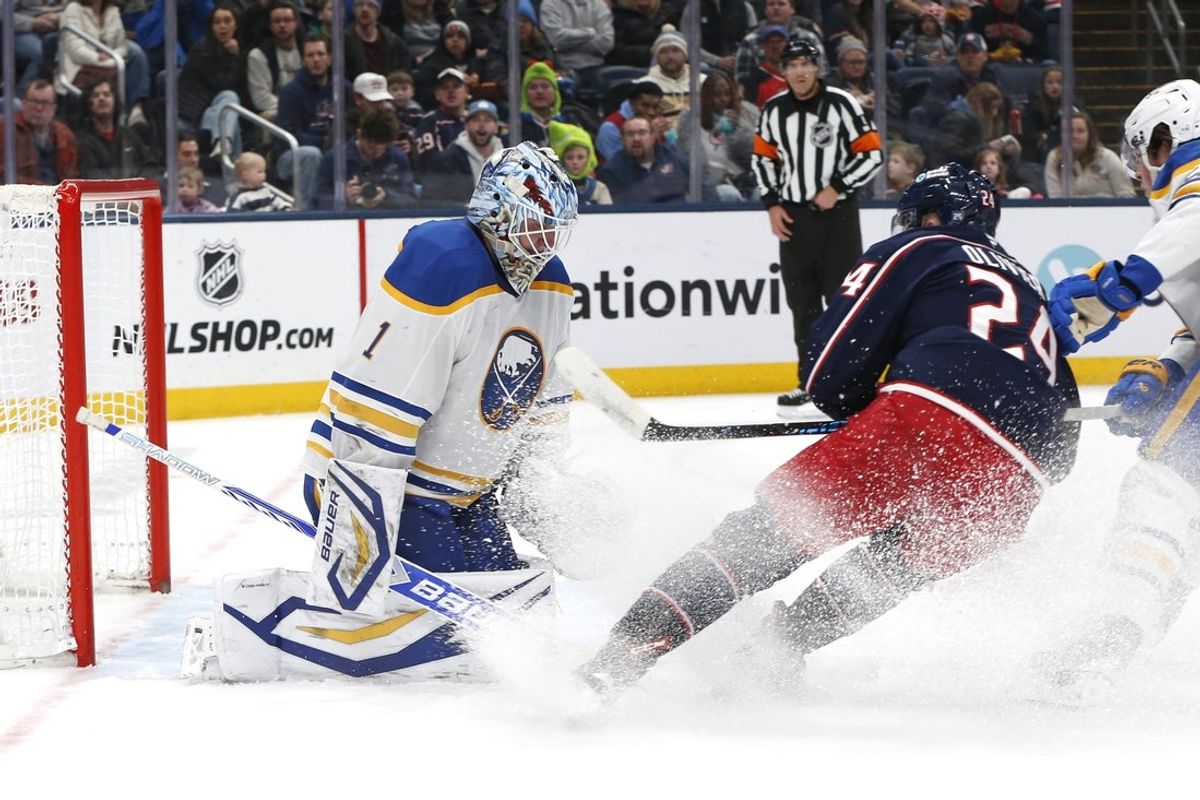 Jan 3, 2026; Columbus, Ohio, USA; Columbus Blue Jackets center Mathieu Olivier (24) scores a goal past Buffalo Sabres goalie Ukko-Pekka Luukkonen (1) during the second period at Nationwide Arena. Mandatory Credit: Russell LaBounty-Imagn Images
