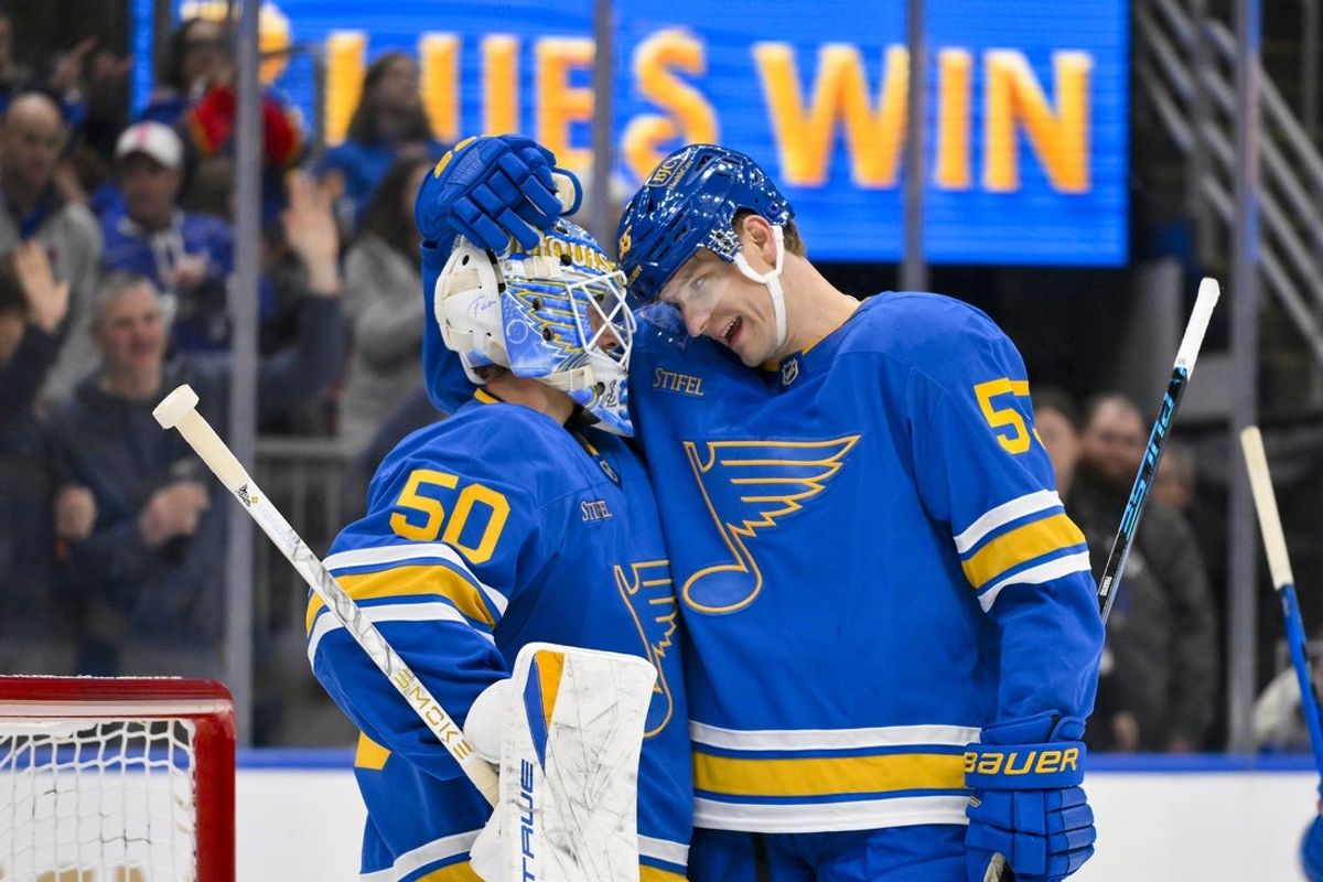 Jan 3, 2026; St. Louis, Missouri, USA; St. Louis Blues goaltender Jordan Binnington (50) celebrates with defenseman Colton Parayko (55) after recording a shutout in a victory over the Montreal Canadiens at Enterprise Center. Mandatory Credit: Jeff Curry-Imagn Images