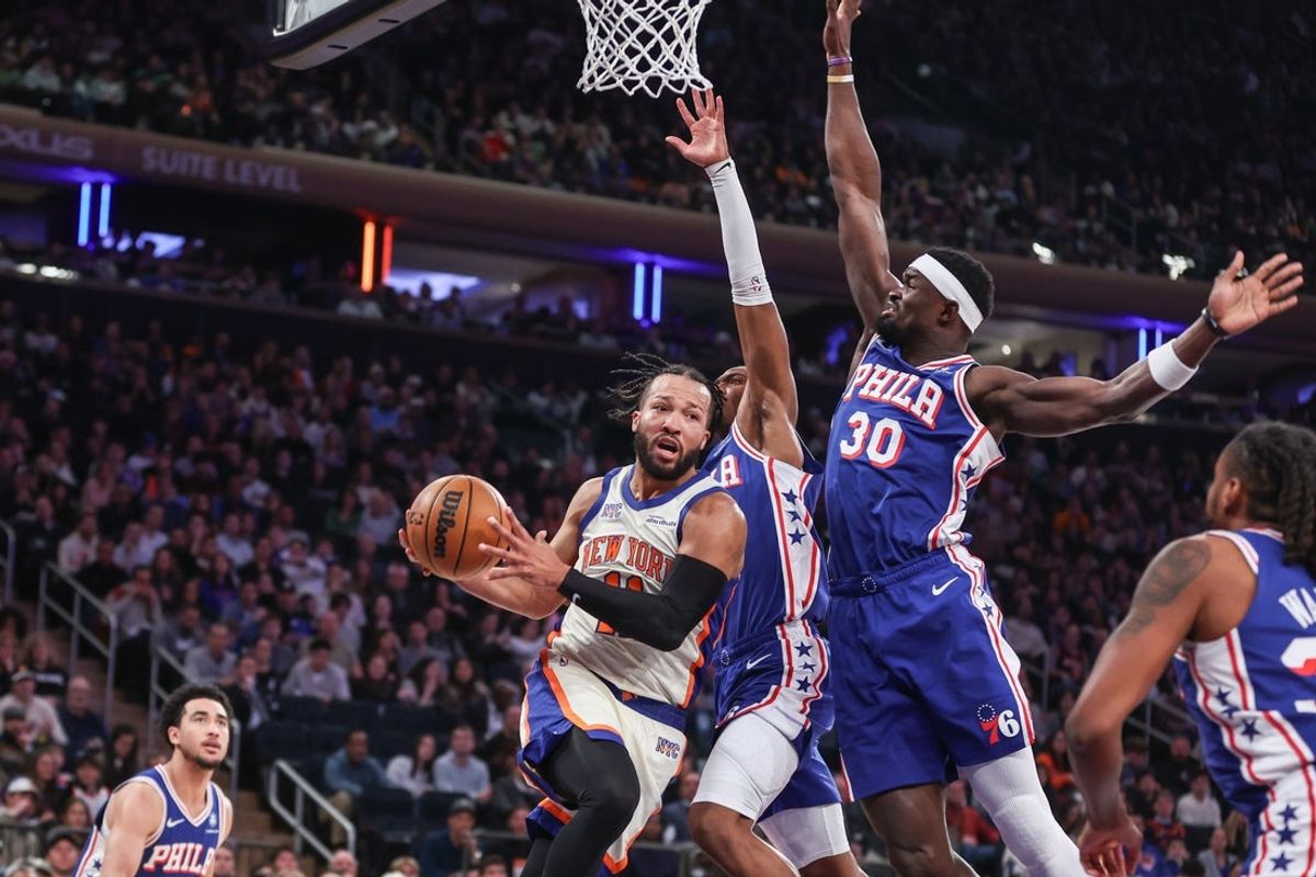 Jan 3, 2026; New York, New York, USA; New York Knicks guard Jalen Brunson (11) drives past Philadelphia 76ers center Adem Bona (30) in the first quarter at Madison Square Garden. Mandatory Credit: Wendell Cruz-Imagn Images