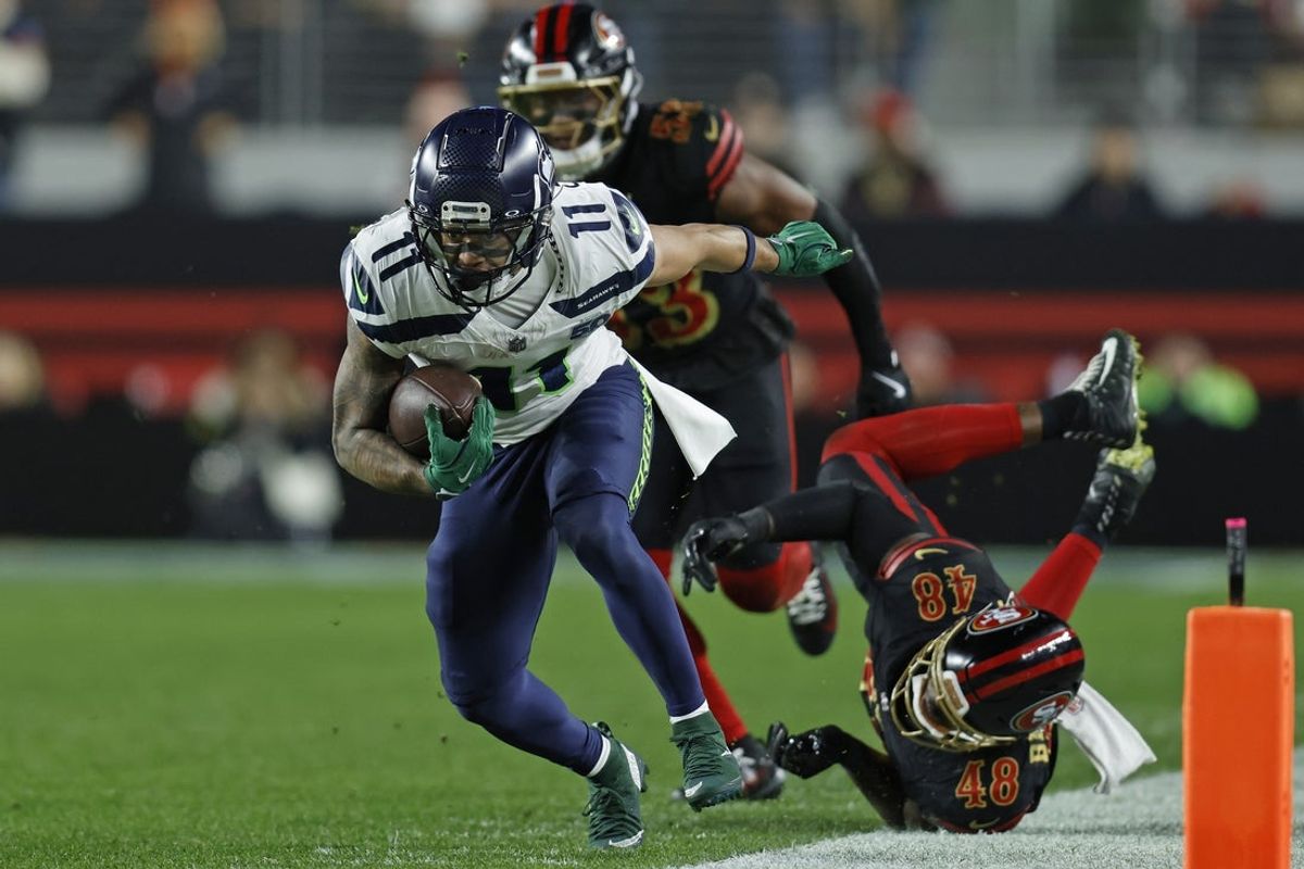 Jan 3, 2026; Santa Clara, California, USA; Seattle Seahawks wide receiver Jaxon Smith-Njigba (11) makes a catch against San Francisco 49ers linebacker Tatum Bethune (48) during the first half at Levi's Stadium. Mandatory Credit: Sergio Estrada-Imagn Images