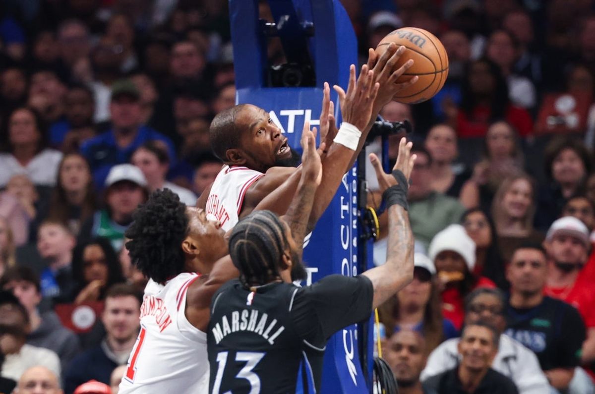Jan 3, 2026; Dallas, Texas, USA;  Houston Rockets forward Kevin Durant (7) and guard Amen Thompson (1) battle for the ball with Dallas Mavericks forward Naji Marshall (13) during the first quarter at American Airlines Center. Mandatory Credit: Kevin Jairaj-Imagn Images