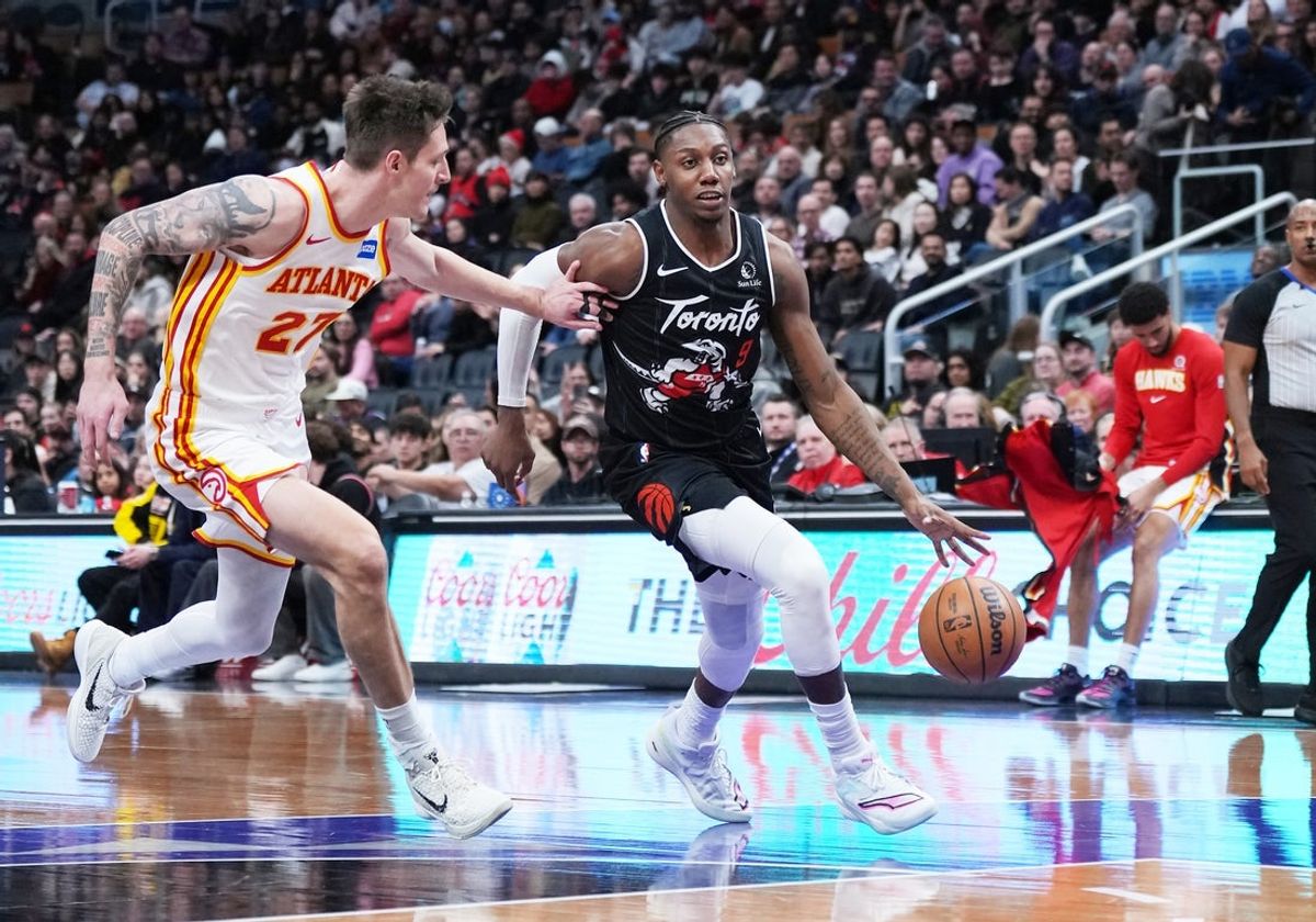 Jan 3, 2026; Toronto, Ontario, CAN; Toronto Raptors forward RJ Barrett (9) controls the ball as Atlanta Hawks guard Vit Krejci (27) tries to defend during the fourth quarter at Scotiabank Arena. Mandatory Credit: Nick Turchiaro-Imagn Images