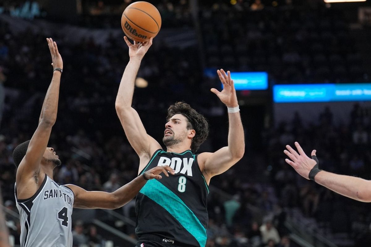 Jan 3, 2026; San Antonio, Texas, USA;  Portland Trail Blazers forward Deni Avdija (8) shoots over San Antonio Spurs guard De'aaron Fox (4) in the second half at Frost Bank Center. Mandatory Credit: Daniel Dunn-Imagn Images